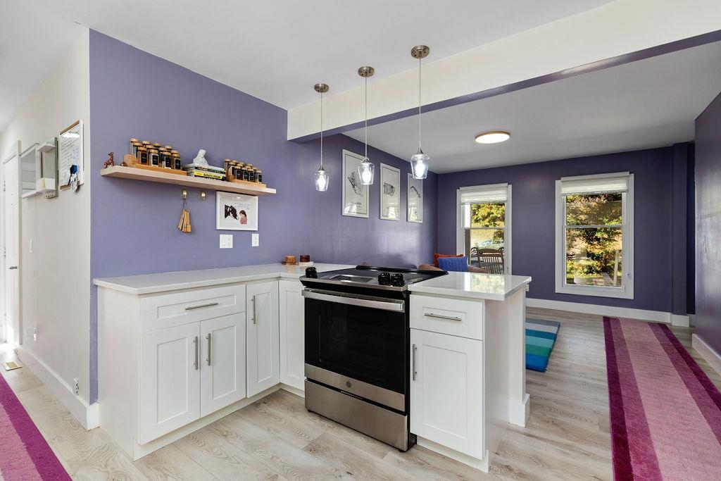 1368 Bluewater Road Harrisonburg, VA 22801 - Photo 8 of 52 a kitchen with granite countertop stainless steel appliances a stove and a window