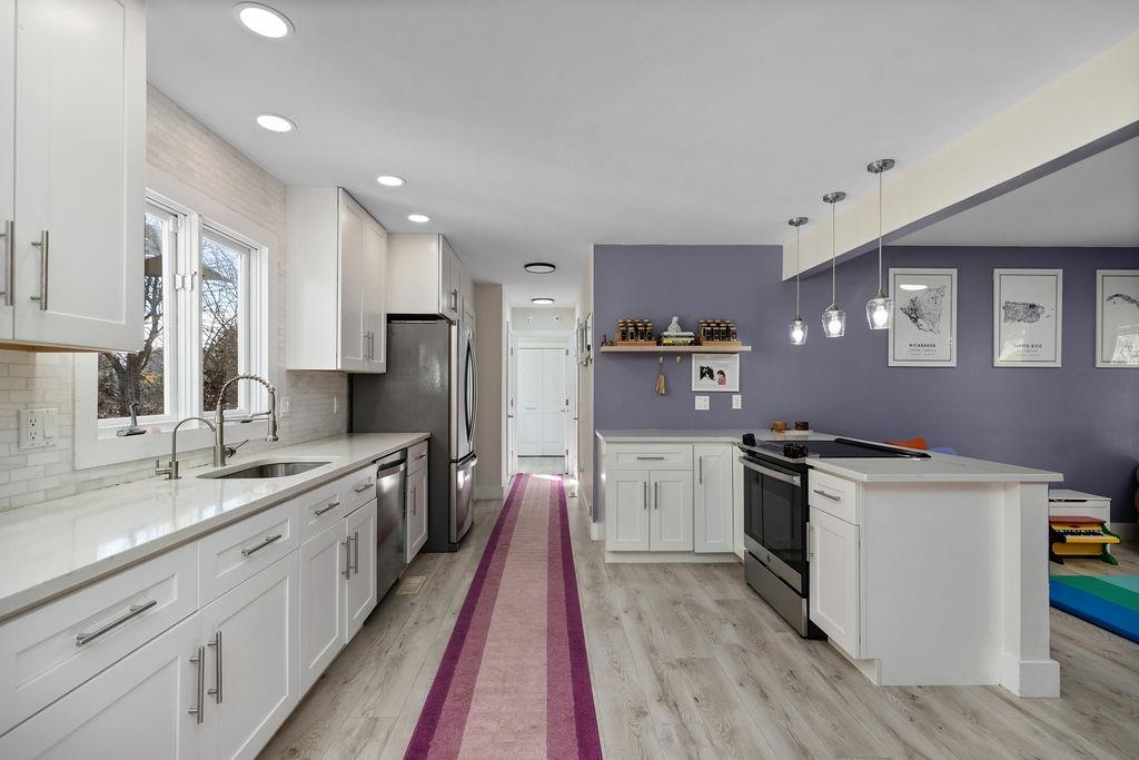1368 Bluewater Road Harrisonburg, VA 22801 - Photo 9 of 52 a kitchen with stainless steel appliances granite countertop a sink stove and refrigerator