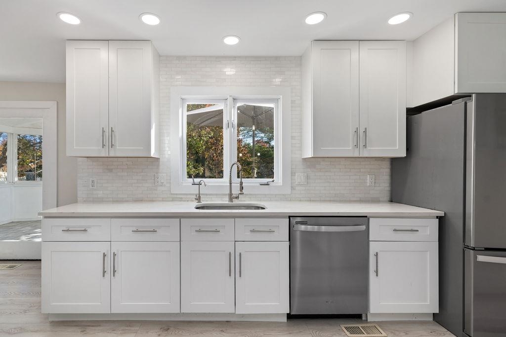 1368 Bluewater Road Harrisonburg, VA 22801 - Photo 10 of 52 a kitchen with white cabinets and sink