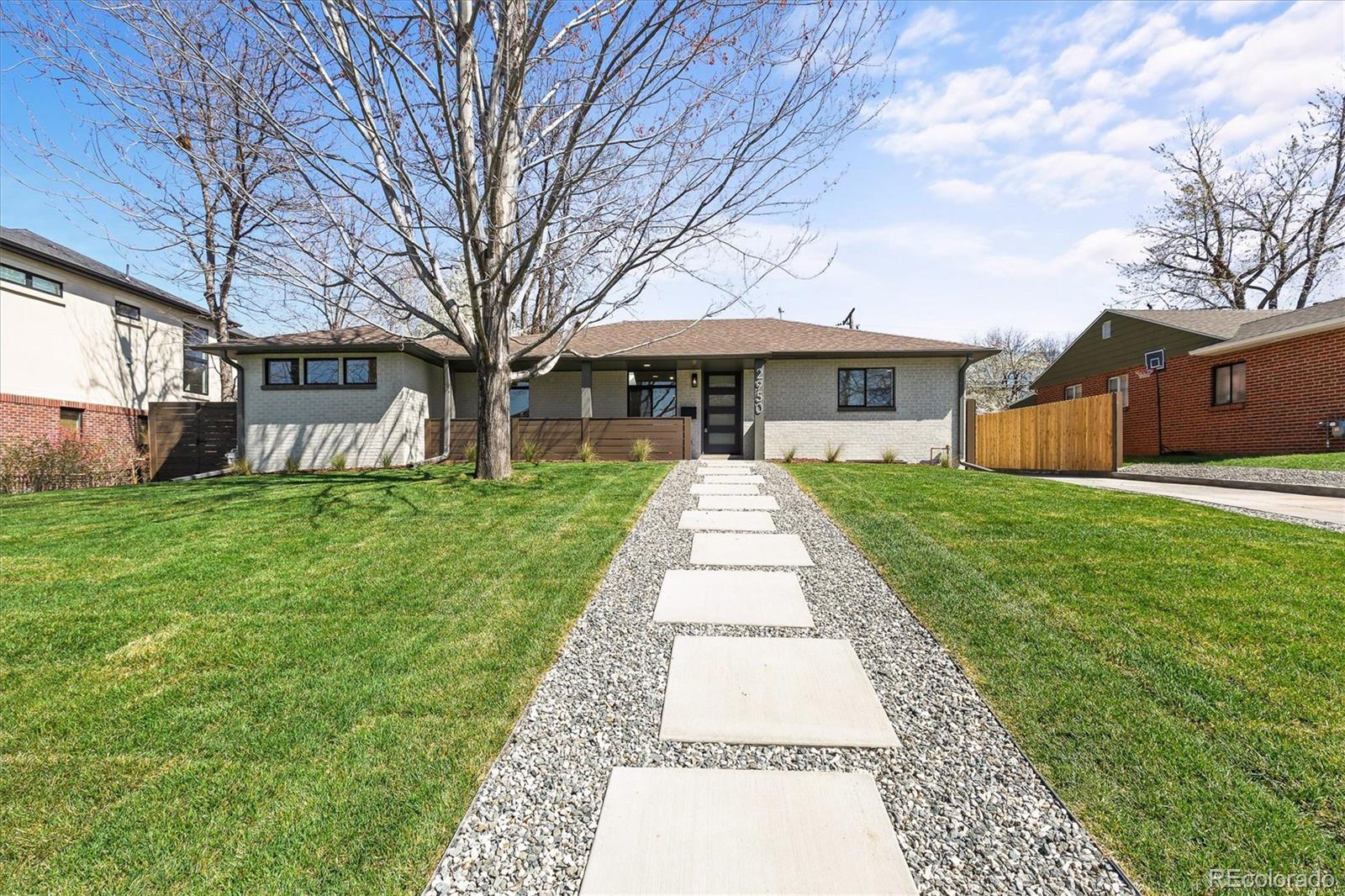2950 South Adams Street Denver, CO 80210 - Photo 2 of 42 a front view of house with yard