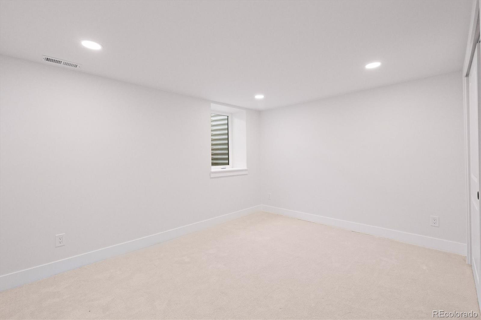 2950 South Adams Street Denver, CO 80210 - Photo 30 of 42 a view of an empty room with a window