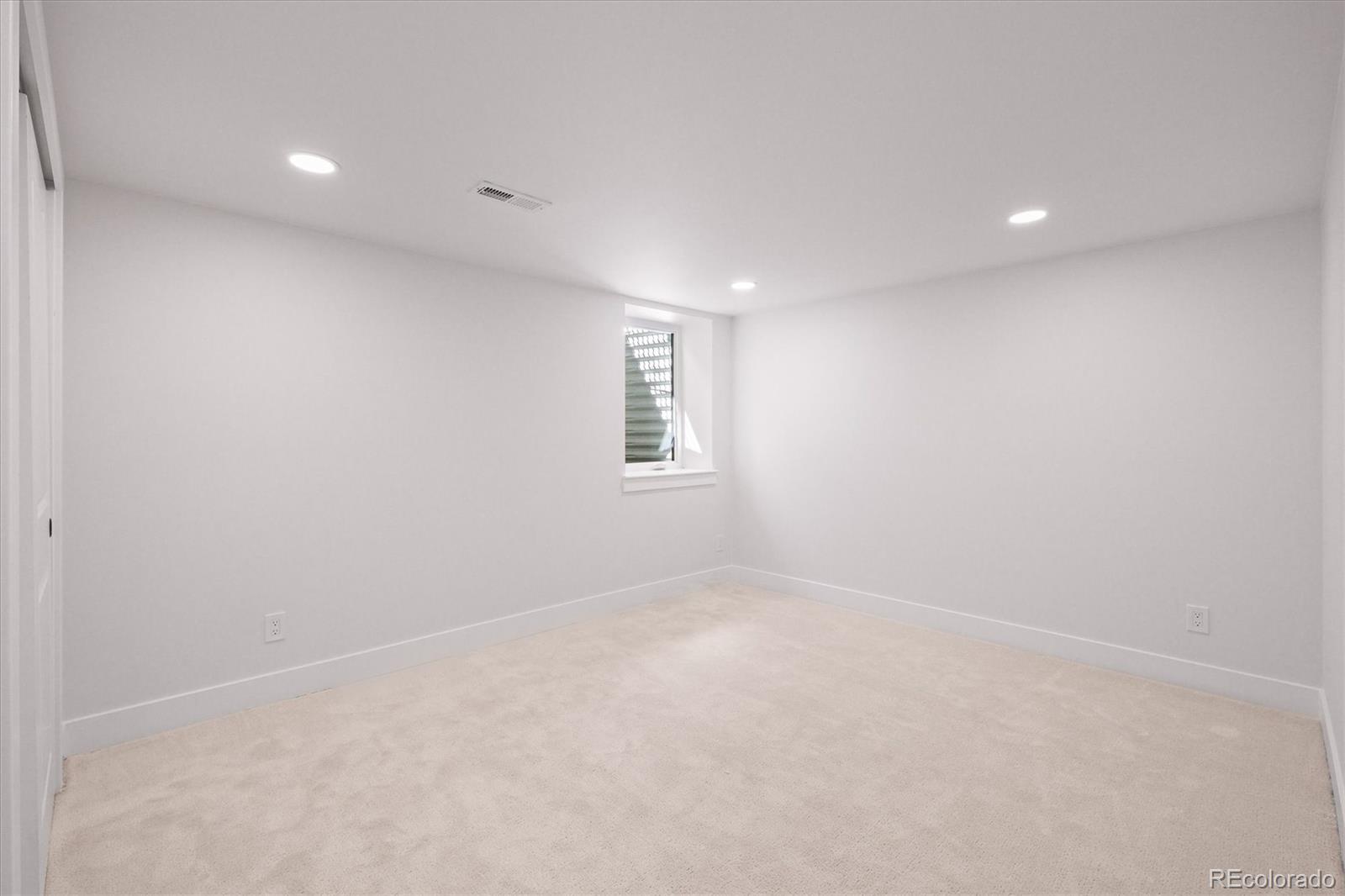2950 South Adams Street Denver, CO 80210 - Photo 31 of 42 a view of an empty room with a window