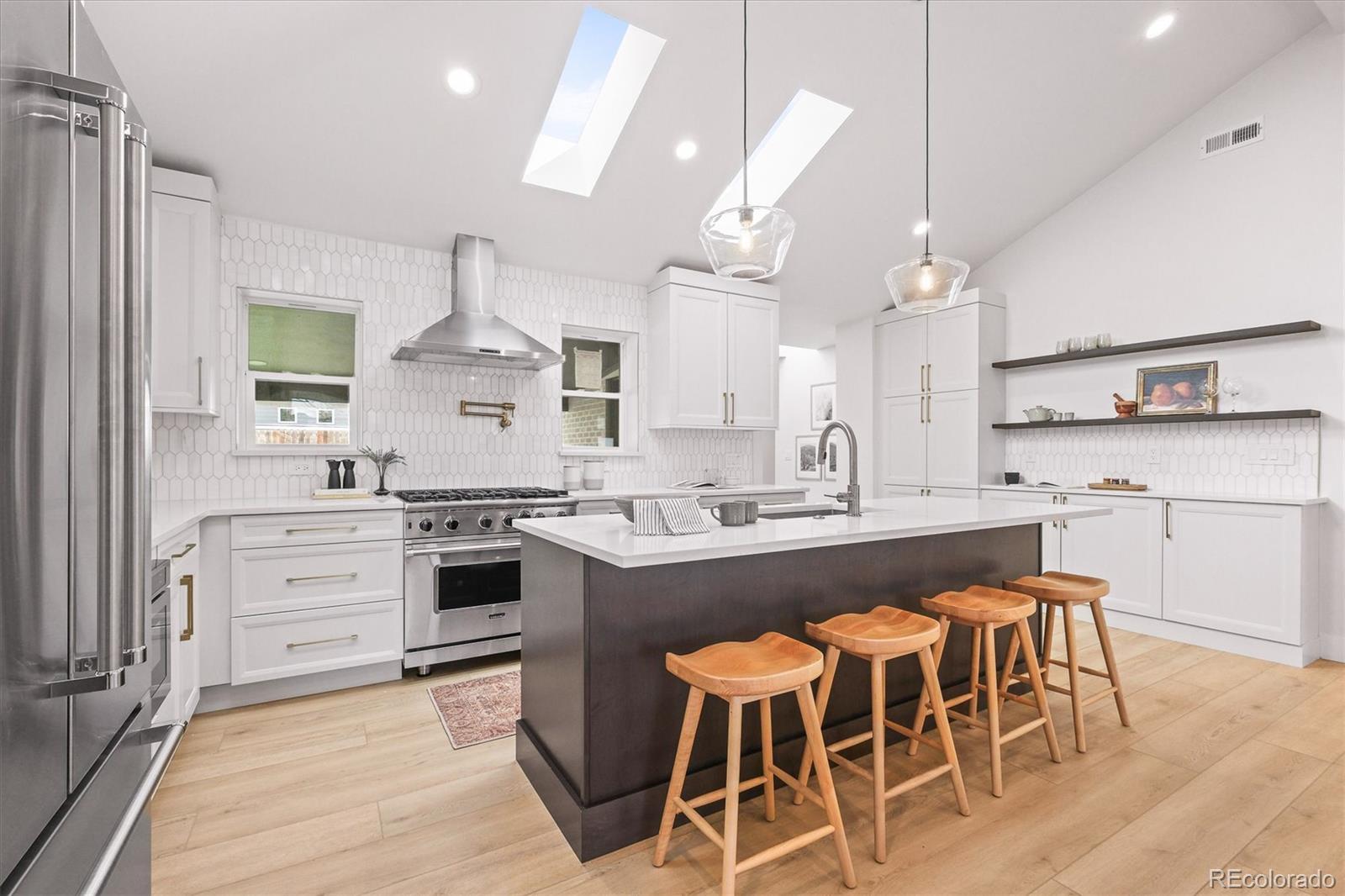 2950 South Adams Street Denver, CO 80210 - Photo 8 of 42 a large kitchen with a table and chairs in it