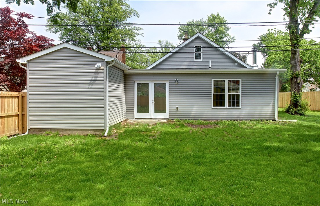 14507 Glencliffe Road Cleveland, OH 44111 - Photo 30 of 31 Rear view of property with french doors and a lawn