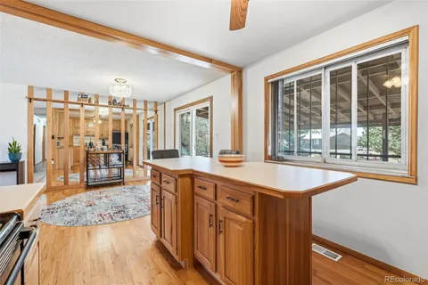 a living room with furniture and a ceiling fan