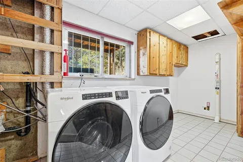 a view of porch with a table and chairs