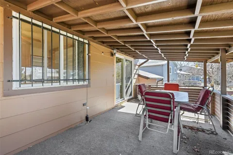 a view of a yard with plants and trees