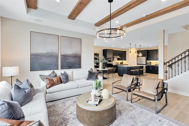 a view of a dining room with furniture and chandelier