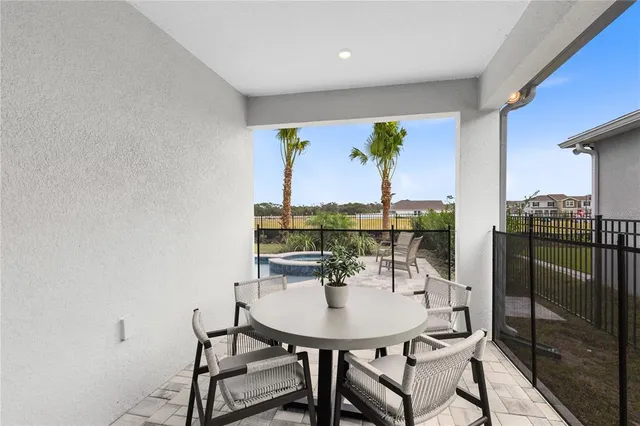a bedroom with a bed and ceiling fan