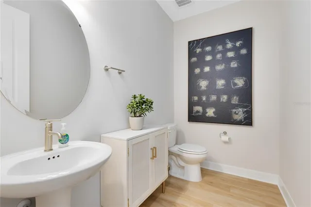 a kitchen with a refrigerator and a sink