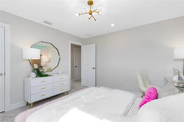 a bedroom with a bed and a dresser