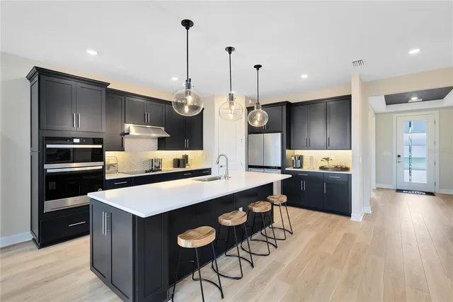 a dining room with furniture window and wooden floor