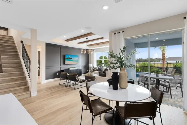 a kitchen with a table and chairs in it