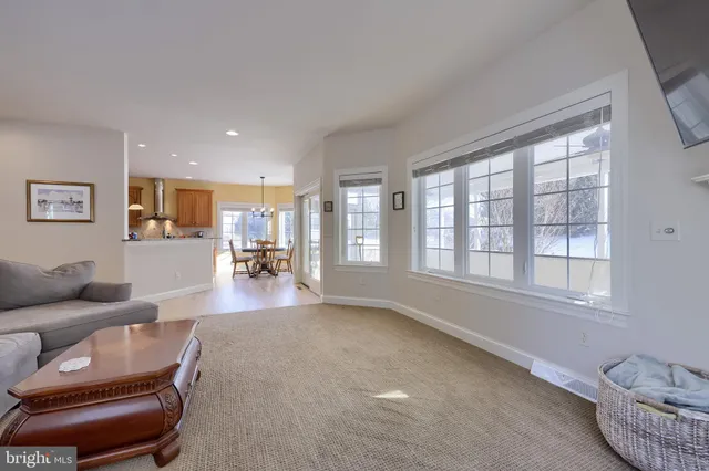 a bathroom with a granite countertop sink and a bathtub