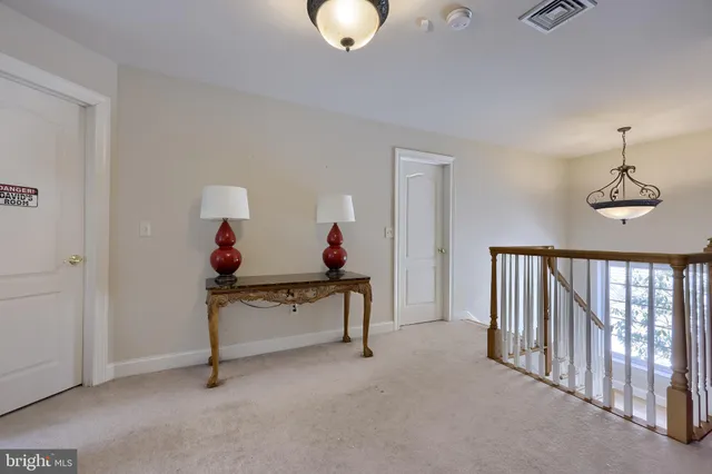 a spacious bathroom with a sink and a mirror