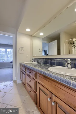 an aerial view of a house with a yard basket ball court and outdoor seating