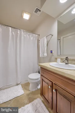 an aerial view of multiple houses with yard