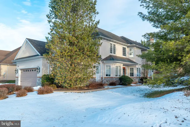an aerial view of a house with outdoor space