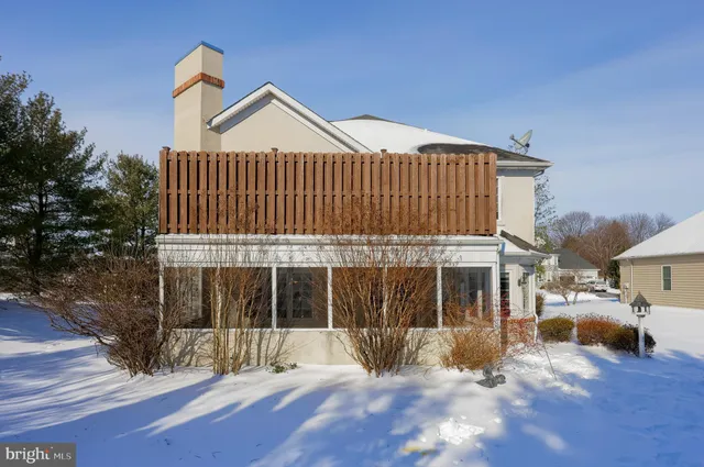 a view of a house with a yard and a garden