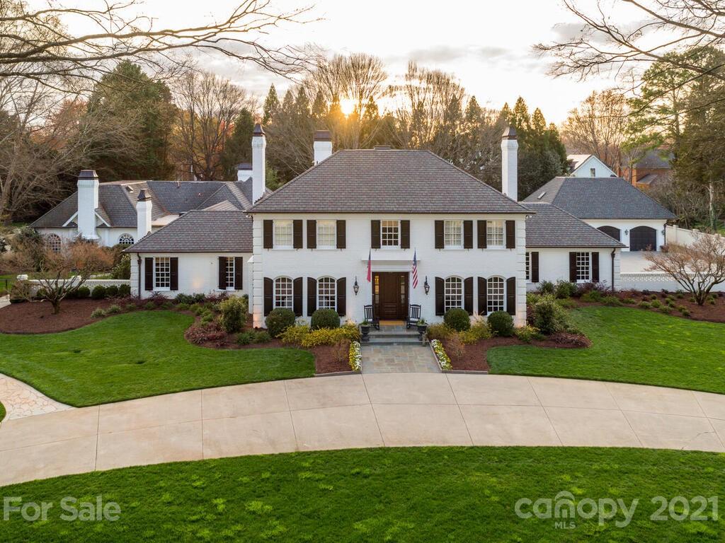 3422 Sharon Road Charlotte, NC 28211 - Photo 1 of 48 a front view of a house with a garden and plants