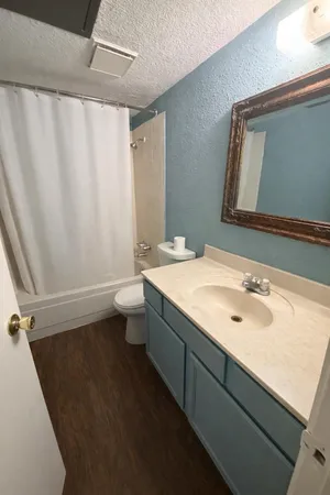 an entryway with an empty room and windows