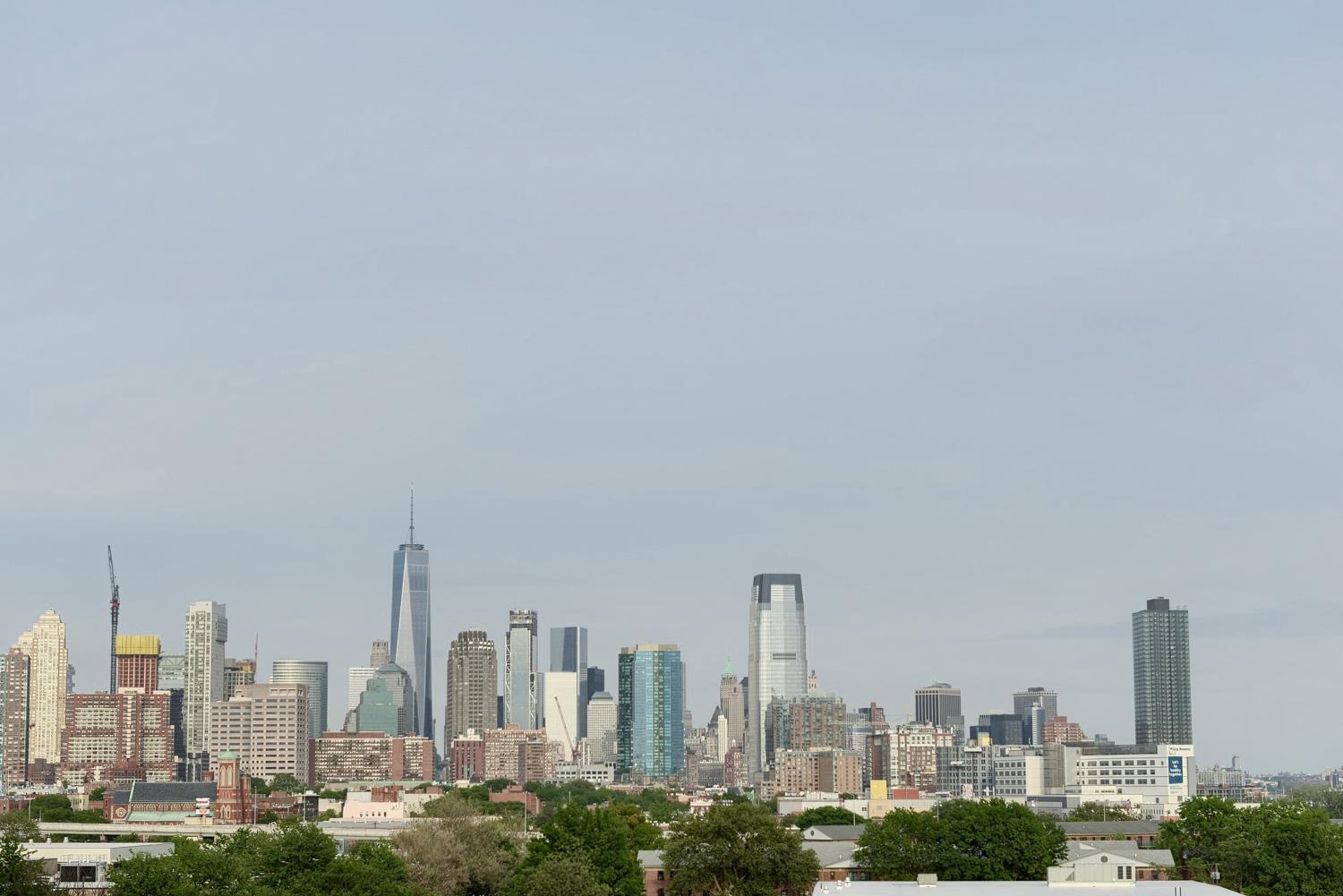 4 Beacon Way, Unit 211 Jersey City, NJ 07304 - Photo 13 of 22 a view of a city with tall buildings in the background
