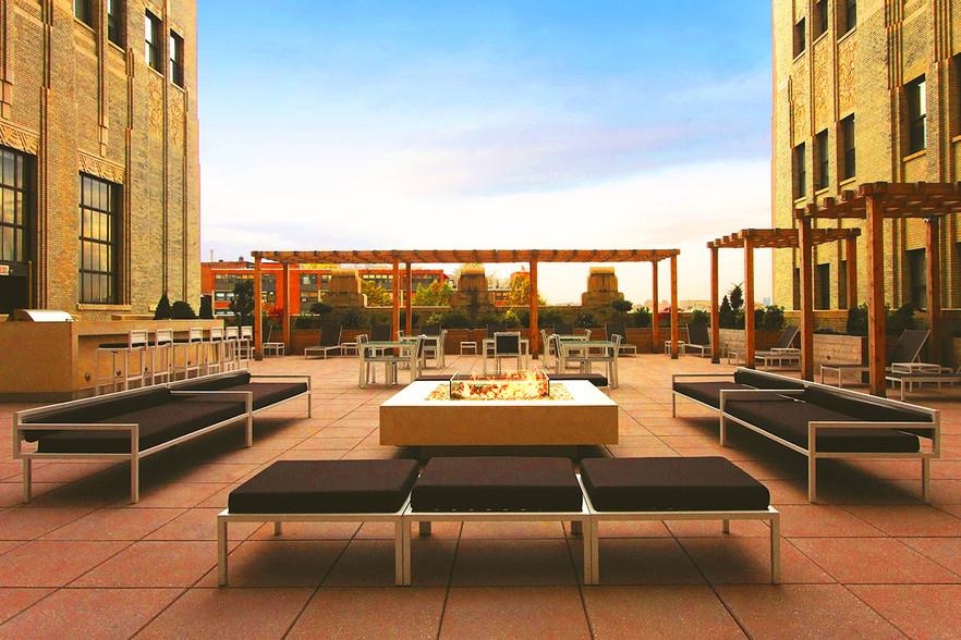 4 Beacon Way, Unit 211 Jersey City, NJ 07304 - Photo 17 of 22 a outdoor space with lots of tables and chairs