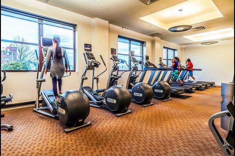 4 Beacon Way, Unit 211 Jersey City, NJ 07304 - Photo 21 of 22 a view of a room with gym equipment