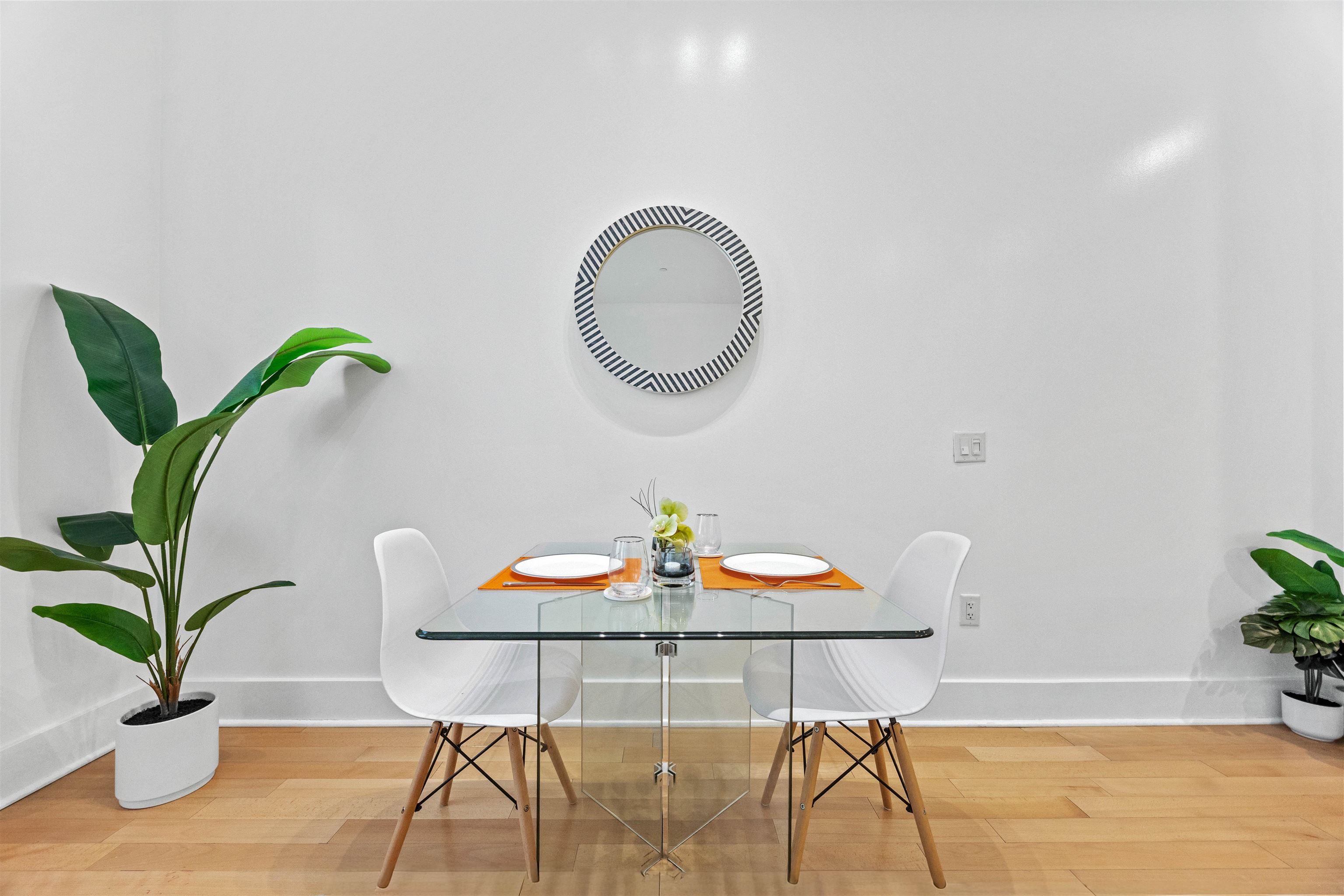 4 Beacon Way, Unit 211 Jersey City, NJ 07304 - Photo 6 of 22 a view of a dining room with furniture and wooden floor