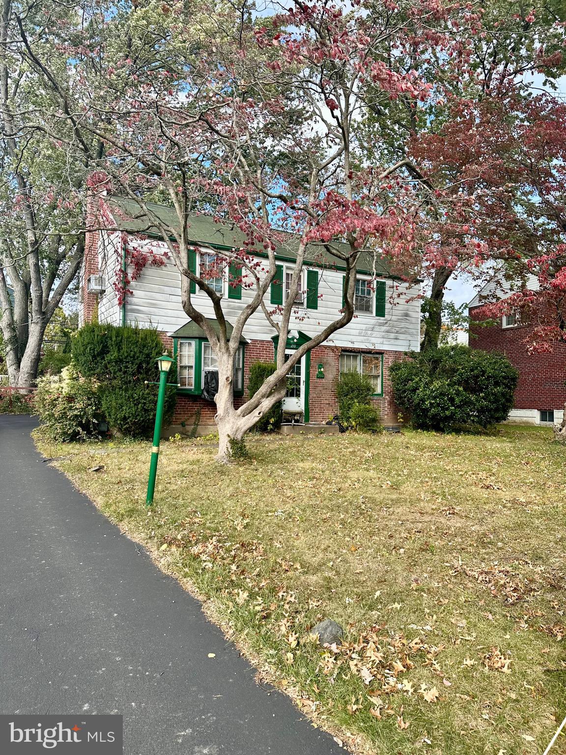 a house with trees in the background