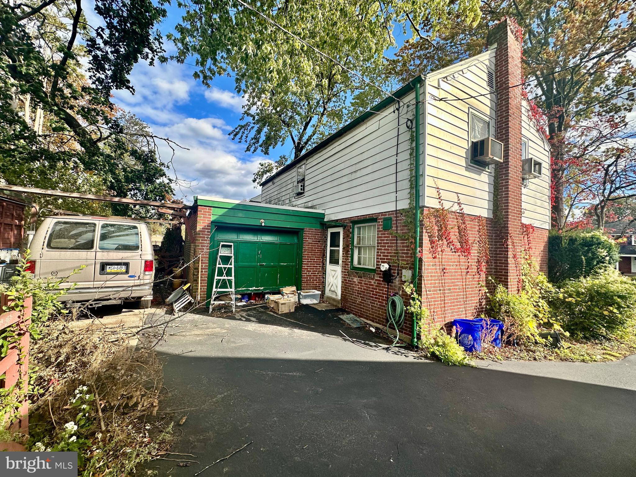 210 Farnham Road Havertown, PA 19083 - Photo 18 of 18 a view of a street with cars park front of a house