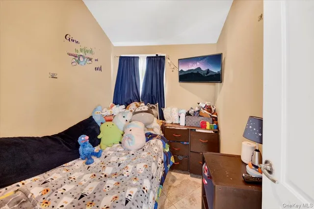 a bedroom with bed and a closet