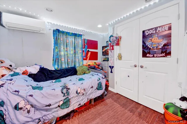 a bed room with a bed and a tv