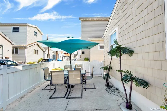 a view of backyard with a patio