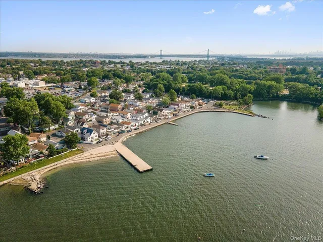 an aerial view of a houses with a lake view