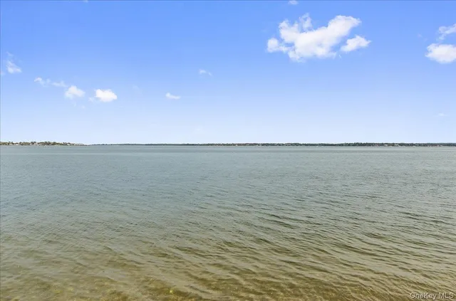 a view of a balcony with ocean view