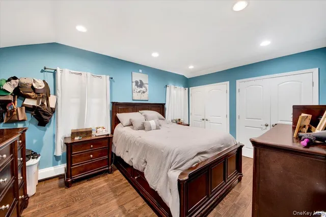 a kitchen with stainless steel appliances a stove a sink a oven a dining table and chairs