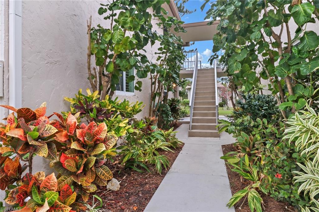 1549 Sandpiper Street, Unit 1 Naples, FL 34102 - Photo 11 of 16 a view of a pathway with plants