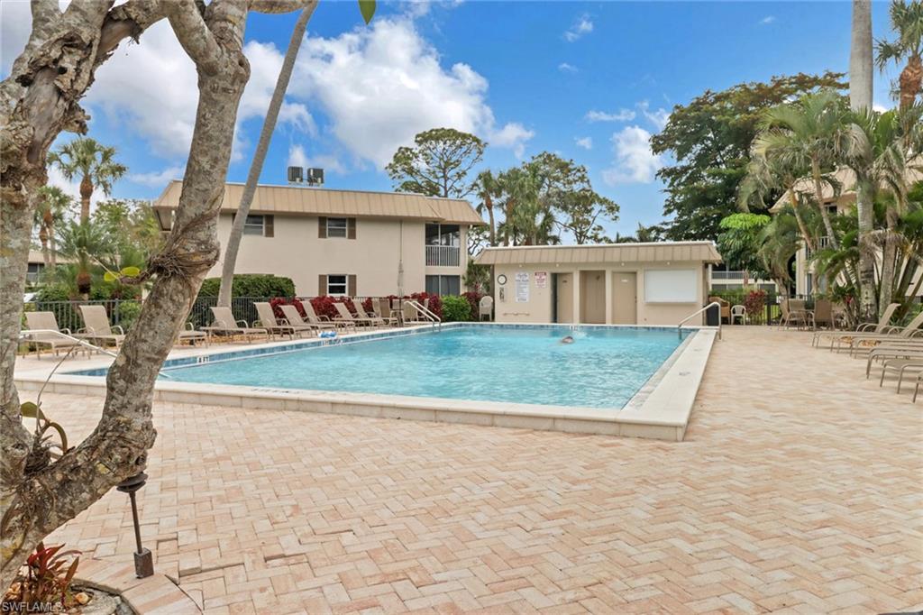 1549 Sandpiper Street, Unit 1 Naples, FL 34102 - Photo 13 of 16 a view of house with outdoor space and sitting area