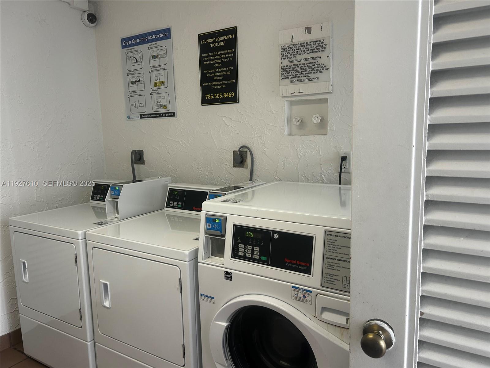 1665 Bay Road, Unit 415 Miami Beach, FL 33139 - Photo 7 of 7 a utility room with dryer and washer