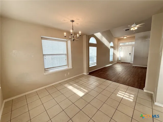 a view of an empty room and window