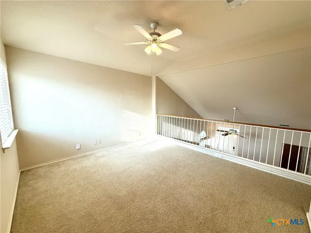 wooden floor in a hall with a window