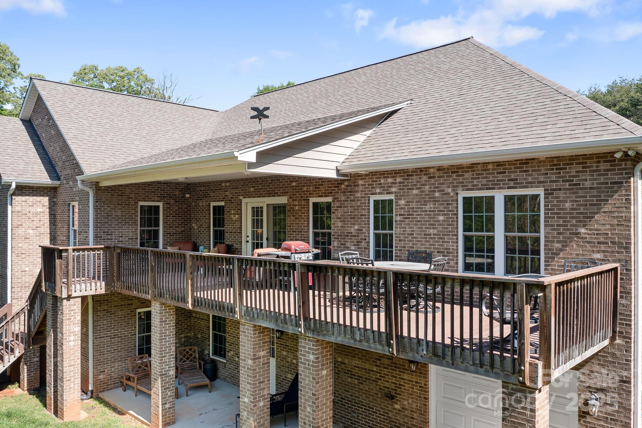 730 Oak Ridge Farms Circle, Unit 14 Newton, NC 28658 - Photo 12 of 42 a view of house with a chairs and table in a patio