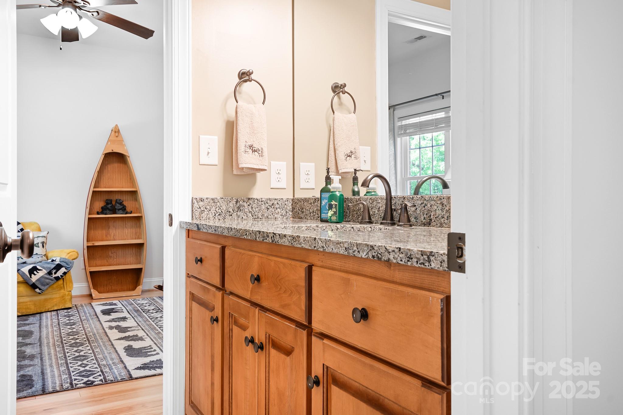 730 Oak Ridge Farms Circle, Unit 14 Newton, NC 28658 - Photo 35 of 42 a kitchen with stainless steel appliances granite countertop a coffee maker on counter top space and cabinets