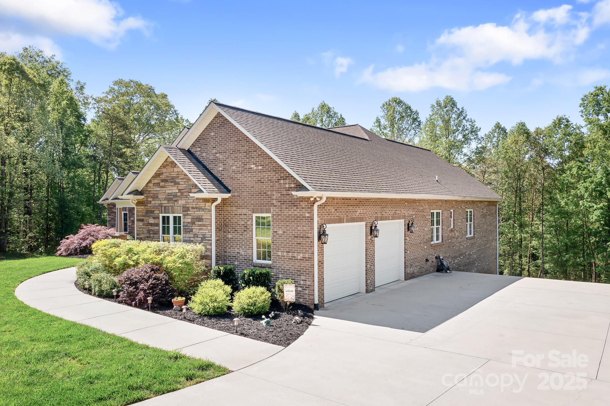 730 Oak Ridge Farms Circle, Unit 14 Newton, NC 28658 - Photo 7 of 42 a view of a house with a yard and potted plants