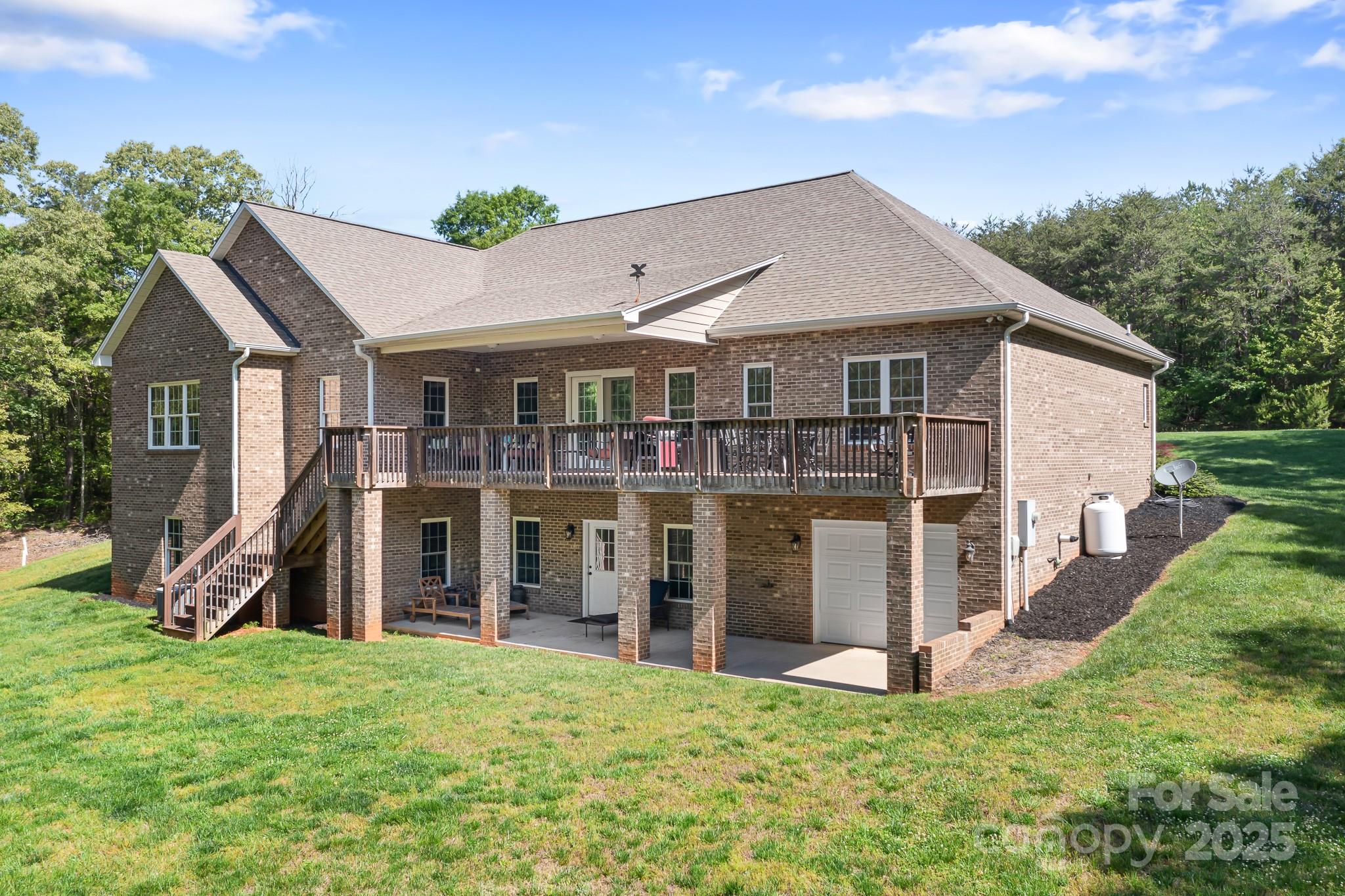 730 Oak Ridge Farms Circle, Unit 14 Newton, NC 28658 - Photo 9 of 42 a view of a house with a yard and potted plants