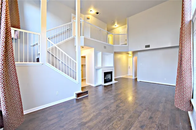 a view of an entryway with wooden floor