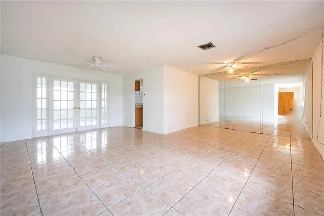 a view of an empty room and window