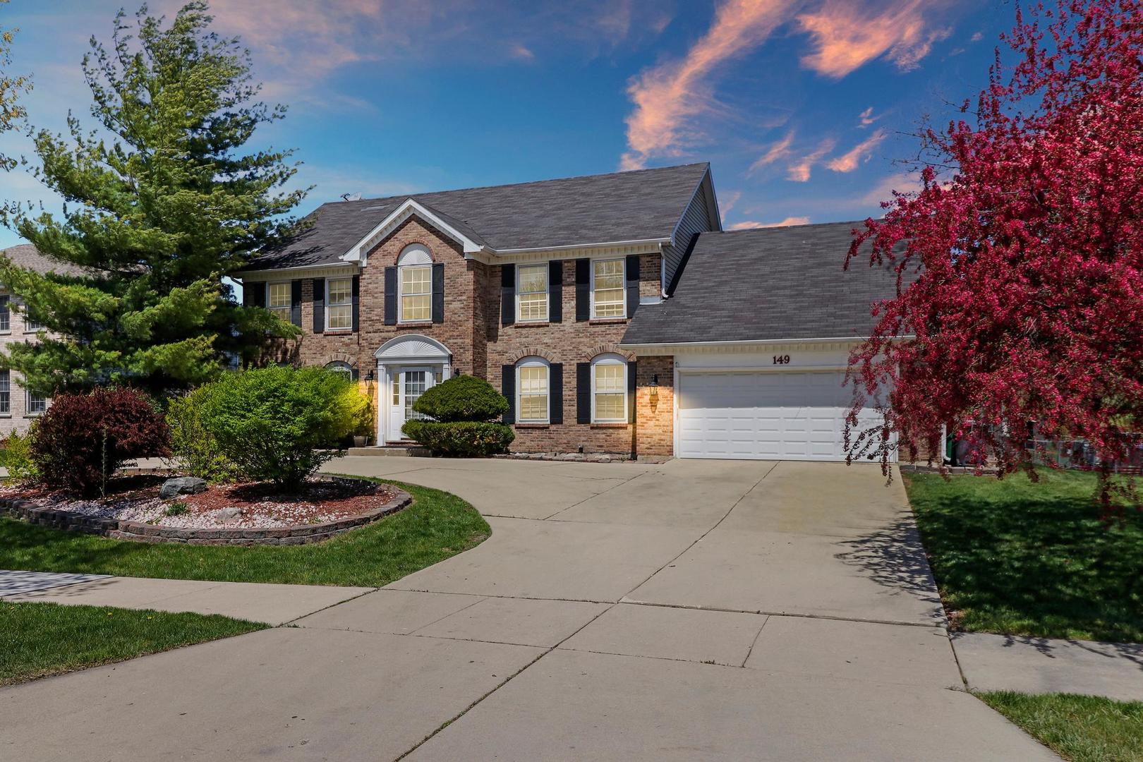 149 West Schick Road Bloomingdale, IL 60108 - Photo 1 of 35 a front view of a house with a yard