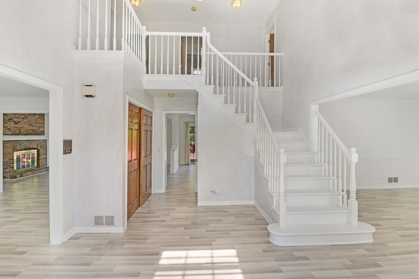 149 West Schick Road Bloomingdale, IL 60108 - Photo 2 of 35 a view of entryway and hall with wooden floor